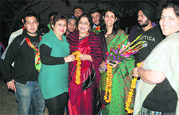 Bollywood actor Kirron Kher (centre, in red saree), who was canvassing in support of BJP candidate Jatinder Pal Malhotra, interacts with residents of Sector 21, Chandigarh, on Wednesday.