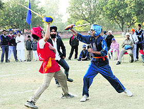 Students in action during a gatka competition at Guru Nanak Khalsa Senior Secondary School, Sector 30, Chandigarh, on Wednesday. Tribune Photo: Manoj Mahajan