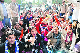 Physical training teachers hold a demonstration in front of the Secretariat in support of their demands in Dehradun on Wednesday. 