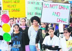 Youngsters carry placards during a WHO-sponsored social awareness campaign against drunken driving in Jalandhar on Wednesday