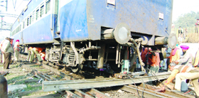 Railway engineers try to bring derailed coaches of the Sachkhand Express on tracks on the Amritsar-Delhi line near Amritsar on Thursday.