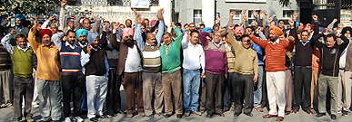 BSNL staff staging a demonstration in front of the BSNL office at Bharat Nagar in Bathinda on Thursday. 