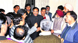 Former Uttarakhand Chief Minister Ramesh Pokhriyal Nishank listens to the agitators in Haridwar on Thursday.