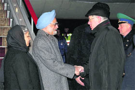 Prime Minister Manmohan Singh and his wife Gursharan Kaur being received by Russias Deputy Foreign Minister AM Vadakin at Moscow international airport on Thursday.