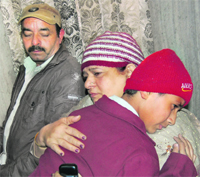 Vansh being hugged by his mother after he reaches Amritsar from Beas on Friday. 