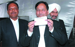District &Session Judge SK Aggarwal takes out a chit at the Judicial Complex in Bathinda on Friday.Aso seen in the picture are CJM Harjit Singh and Bar Association president Rajan Garg 
