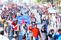 Unemployed lineman hold a protest march in support of their demands in Bathinda on Friday. 