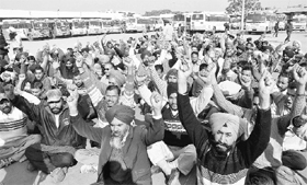 Punjab Roadways employees protest in support of their demands at ISBT, Sector 43, Chandigarh, on Friday.