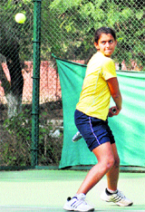 Bhavika returns a shot during a final match at CLTA, Sector 10, Chandigarh, on Friday.