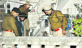 SSP Naunihal Singh and other officials inspect the house at Sector 41 in Chandigarh on Friday.