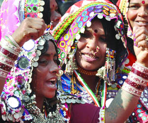 Women dance during a conference on empowerment for tribal women, organised by the All-India Mahila Congress in New Delhi on Friday. 