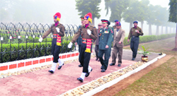 Brig Suresh Sharma of the Bengal Engineer Group and Centre, Roorkee, walks towards the War Memorial to lay wreaths to commemorate the 1971 war martyrs in Roorkee on Friday.