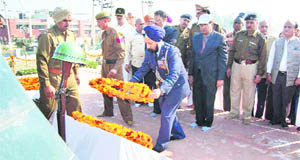 Air Commodore SP Singh places a wreath on the martyrs memorial at Sirsa on Friday.
