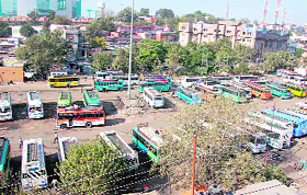 Bus operators park buses in the area where a multi-storeyed parking lot was to come up.