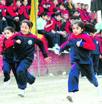 Children participate in a 100m race during an athletics meet at KVM School in Ludhiana.