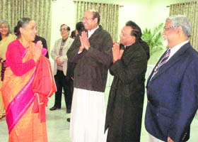 Governor Margaret Alva exchanges greeting with the guests during the Christmas celebrations in Dehradun on Saturday