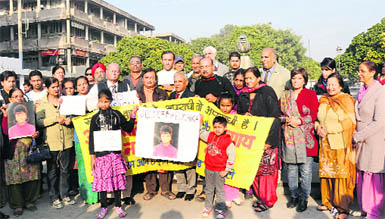 Members of the Citizen Forum on Human Rights protest in Chandigarh on Saturday. 