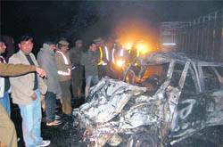 The remains of the ill-fated car which caught fire in Samalkha on Friday night.  