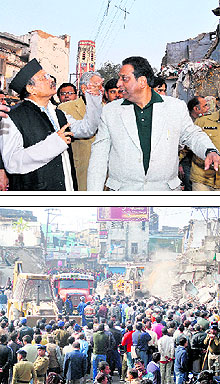 (Above) Chief Minister BC Khanduri with Dehradun Mayor Vinod Chamoli at the demolition site. A Tribune photograph; and(below) Bulldozers raze shops in the Clock Tower area