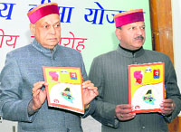 Chief Minister Prem Kumar Dhumal launches the Rashtriya Swasthya Bima Yojna in Dharamsala on Sunday