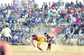 Players in action during the kabaddi final of the Jarkhar Sports Festival on Sunday