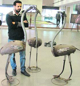 Harminder Singh Boparai with his art pieces at an exhibition in Ludhiana on Sunday