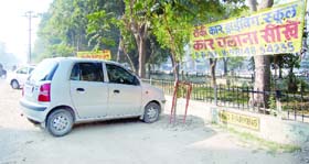 A banner of an illegal driving school hangs in Ranjit Avenue in Amritsar