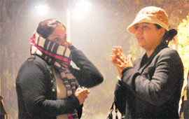 Freezing moments: Shoppers wrap themselves up in woollens to beat the cold in Sector 17, Chandigarh, on Monday.