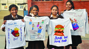 Children of Father Angnel School campaign against the consumption of junk food in New Delhi on Monday. 