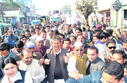 Union Minister of State for Parliamentary Affairs Harish Rawat and Congress activists during the pad yatra at Jwalapur in Haridwar on Monday.