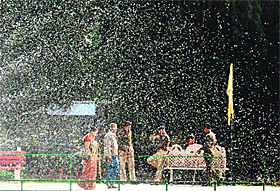 A couple walks past water droplets being formed by a fountain at the Terraced Garden in Sector 33, Chandigarh.