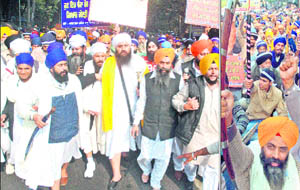 Sikh community members hold a procession in Parliament street in New Delhi on Tuesday, demanding rebuilding of Gurdwara Gian Godri Sahib in Haridwar, which had been demolished a few years ago.