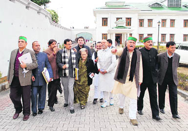 Congress MLAs stage a protest in front of the Vidhan Sabha complex in Dharamsala on Tuesday. 