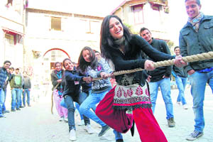 Girls participate in tug of war during the sports meet at a Sanjauli college in Shimla on Tuesday.