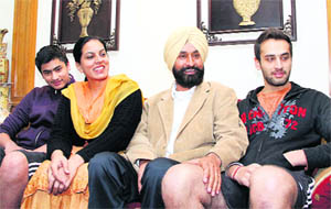 Jagbir Brar with his wife Ravneet Brar and sons Angadbir and Jaibir at his residence in Jalandhar on Tuesday.