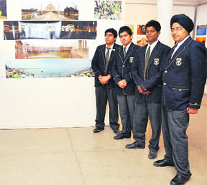 Students pose before their work.