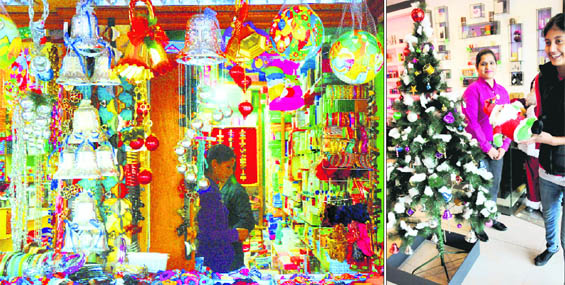 A shop at Sector 15 displays Christmas decorations; and (right) another at Sector 17 has a bedecked Christmas tree in Chandigarh on Wednesday. 