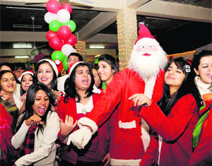 Students of INIFD dance during a Christmas party at Sector 27 in Chandigarh on Wednesday.