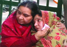 Grieving relatives of the victim policeman at GTB Hospital