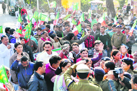 Workers of the Uttarakhand Kranti Dal (Panwar) stage a demonstration on the road leading to the CMs residence in Dehradun on Wednesday. A Tribune photograph