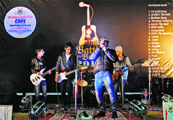 A Kashmiri youth rock band performs during a music competition organised by the CRPF in Srinagar on Wednesday.  AFP