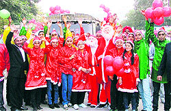 Participants of a road show to mark Christmas Carnival in Ludhiana on Wednesday