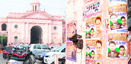 Posters pasted on the entry of the Town Hall building, which houses the Municipal Corporation office, in Amritsar.