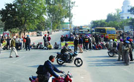 Agitating pharmacists block the vehicular traffic in front of the Civil Hospital in Bathinda on Thursday. 