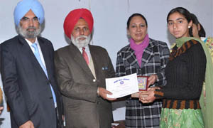 Dr Jeet Singh Joshi, Head, Punjabi University Regional Centre, Bathinda, presenting certificate to a student on the concluding day of the NSS function held on Wednesday. 