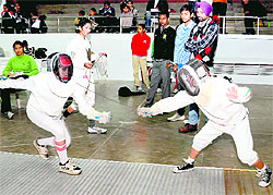 Fencers engaged in a duel during the Inter-College Fencing Competition at Panjab University in Chandigarh on Thursday