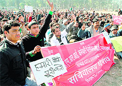 Striking employees of EMRI emergency services hold a demonstration in Dehradun on Thursday