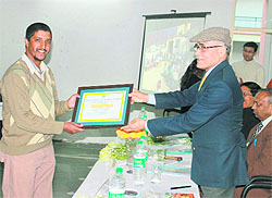 Major-General RM Kharb (Retd.), Chairman of the Animal Welfare Board of India (AWBI), gives awards at a function in Dehradun on Thursday