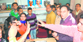 Students of SMJN College, accompanied by outsiders, creating a ruckus in front of the Principals office in Haridwar on Thursday.