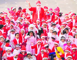 Students dressed in colourful attire to celebrate Christsmas at St Xaviers Playway School in Ludhiana. 
